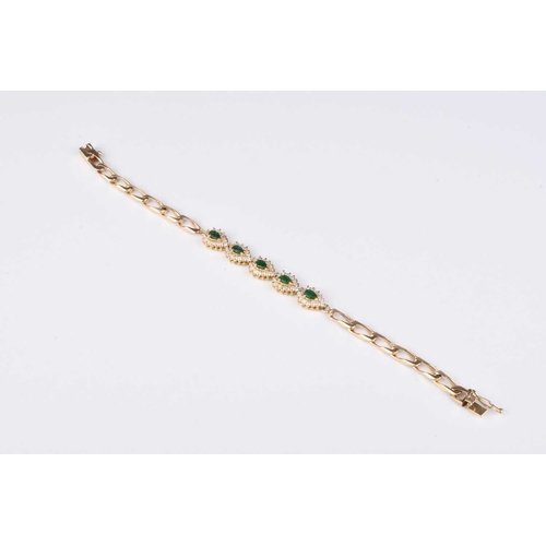 69 - A diamond and emerald bracelet, designed as five pear shaped emerald and diamond clusters claw set i... 