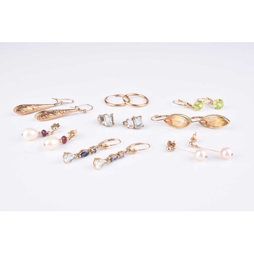 70 - A collection of 9ct gold and yellow metal earrings, to include; a pair of 9ct gold marquise citrine ... 