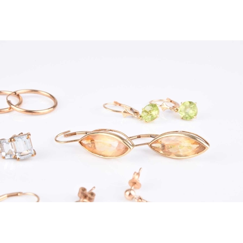 70 - A collection of 9ct gold and yellow metal earrings, to include; a pair of 9ct gold marquise citrine ... 