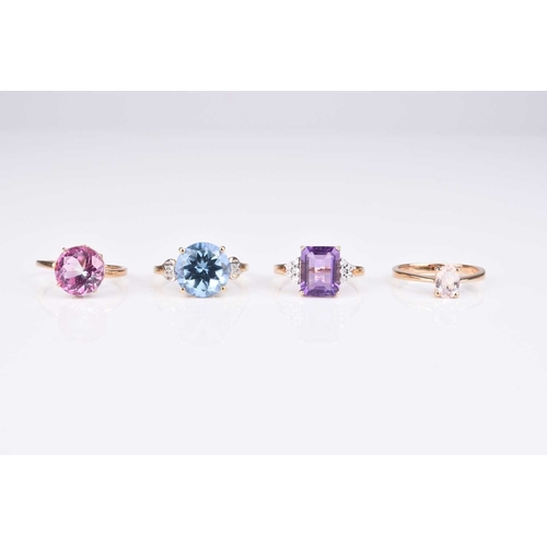 76 - A 9ct gold blue topaz ring, size N 1/2, together with a 9ct gold amethyst ring, size L 1/2, a 9ct go... 