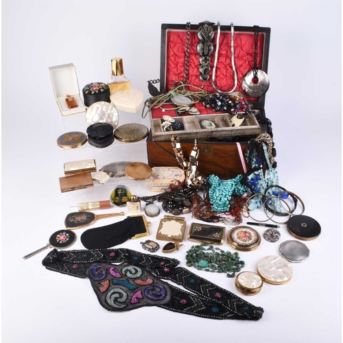 89 - A collection of costume jewellery and compacts, to include; a shaped oval engine turned silver compa... 