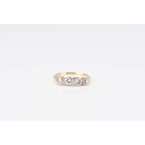 96 - A graduated four stone diamond ring, the brilliant cut diamonds collet set in white metal to yellow ... 