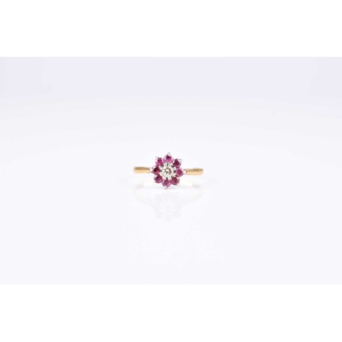 99 - A ruby and diamond floral cluster ring, size L, the yellow metal shank stamped 'plat 18ct', weight a... 