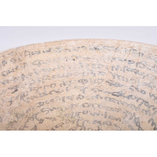 32 - A Sasanian incantation bowl 6th-7th century AD The buff earthenware bowl of conical form, the interi... 