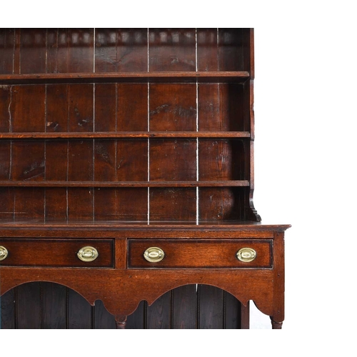 40 - An 18th century oak dresser and rack, South Wales With a three-tier graduated plate rack with openwo... 