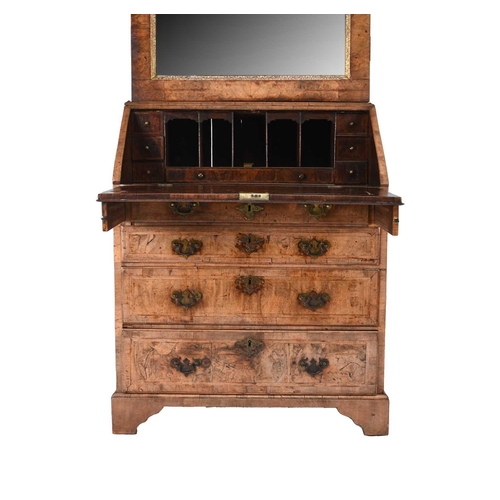 42 - A George II feather-banded walnut bureau cabinet The top cabinet, probably associated, with a single... 