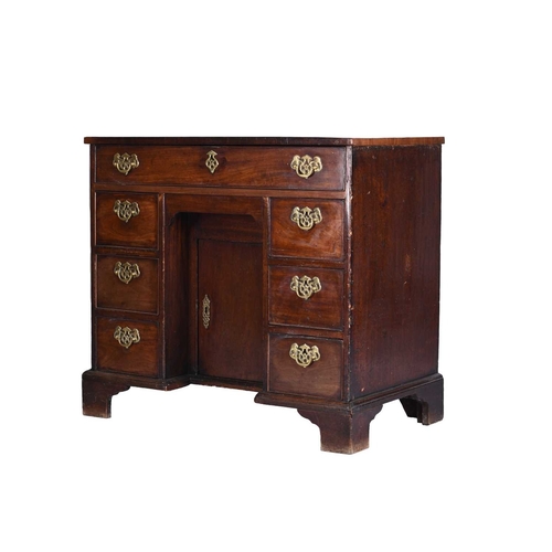 47 - George III mahogany kneehole desk The cross-banded top above a single frieze drawer, the kneehole fl... 