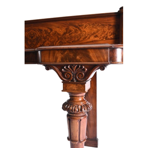 51 - A William IV Irish mahogany breakfront sideboard The flame figured back between turned columns, the ... 