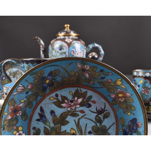 52 - A Chinese cloisonne tea service, 19th century Worked with shaped panels of auspicious flowers and fo... 