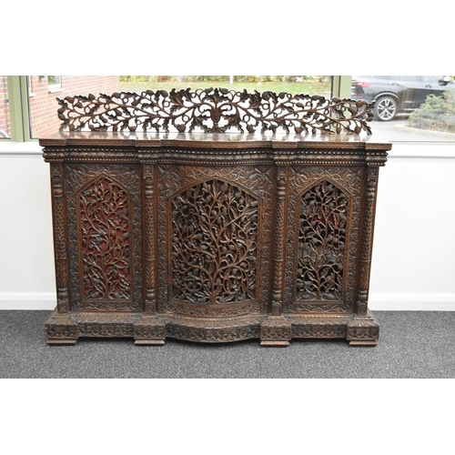 53 - An Anglo-Indian carved rosewood cabinet, 19th century The top with pierced gallery back carved with ... 