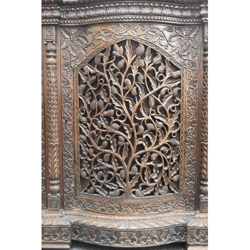 53 - An Anglo-Indian carved rosewood cabinet, 19th century The top with pierced gallery back carved with ... 