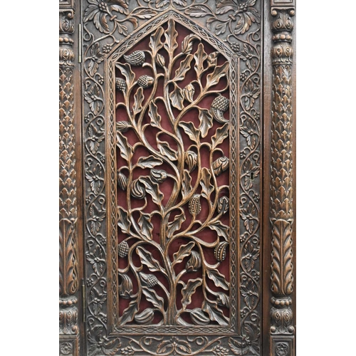 53 - An Anglo-Indian carved rosewood cabinet, 19th century The top with pierced gallery back carved with ... 