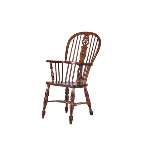 54 - A early-mid 19th century ash and elm Windsor armchair Of hoop-back form, the shaped splat with pierc... 