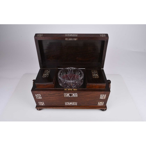 55 - A Victorian rosewood tea caddy Of sarcophagus form with twin ring handles, inlaid with mother-of-pea... 