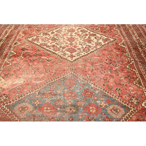 67 - A large Khamseh 'chicken' carpet Late 19th / early 20th century With multiple blue and beige geometr... 