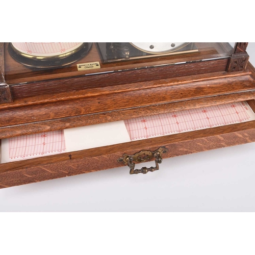 68 - An early 20th Century oak-cased combination barograph and barometer Bearing ivorine plaque reading '... 