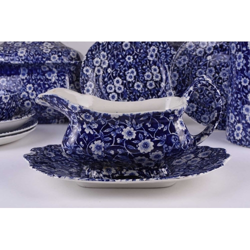 102 - A Burleigh Ironstone 'Calico' dinner service, 20th century, transfer-printed in blue, the service co... 