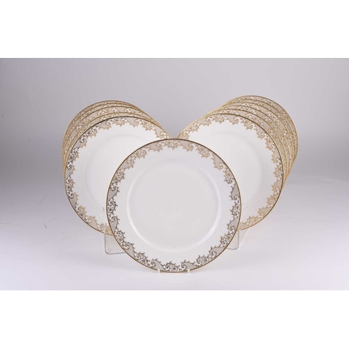 108 - A set of twelve Sevres porcelain dinner plates, late 19th century, plain white with trailing trellis... 