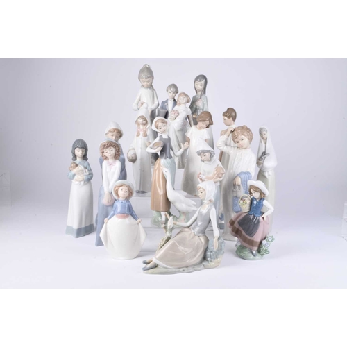 109 - A collection of Lladro and Nao figures, late 20th/early 21st century, including a woman in a shawl h... 