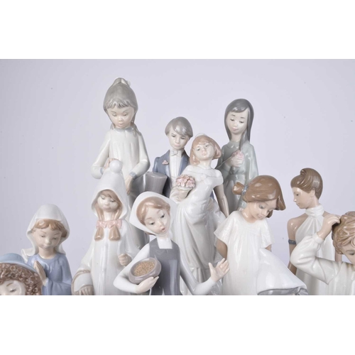 109 - A collection of Lladro and Nao figures, late 20th/early 21st century, including a woman in a shawl h... 