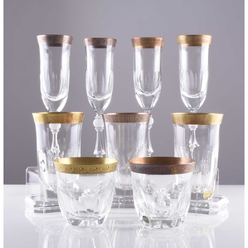 11 - A suite of Czech Bohemian Lord crystal drinking glasses with acid-etched gilt rims, retailed by Harr... 