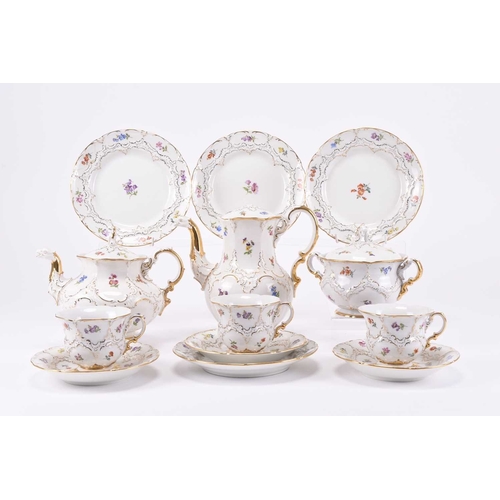 110 - A Meissen part cabaret tea and coffee service, 20th century, of B-form, with twice cancelled crossed... 