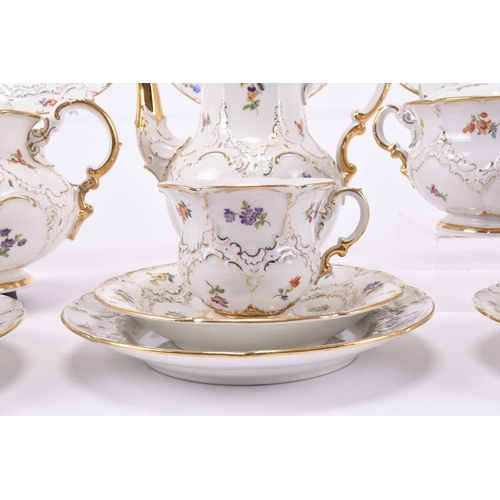 110 - A Meissen part cabaret tea and coffee service, 20th century, of B-form, with twice cancelled crossed... 