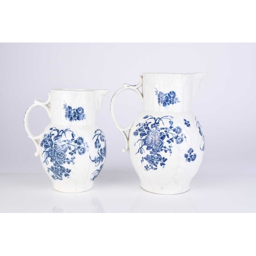 14 - Two Caughley porcelain 'Bouquets' cabbage leaf maskhead jugs, circa 1785, transfer-printed in underg... 