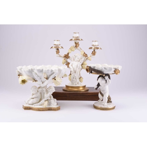 38 - A group of Moore Brothers pottery, late 19th century: A figural candelabra in the form of a cherub w... 