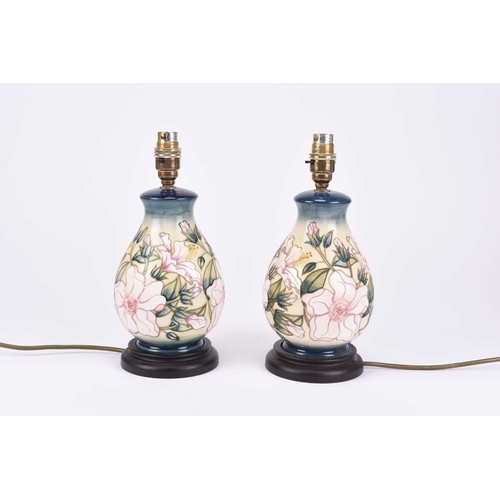 47 - A pair of Moorcroft 'Hibiscus Moon' baluster table lamps, early 21st century, with original Moorcrof... 