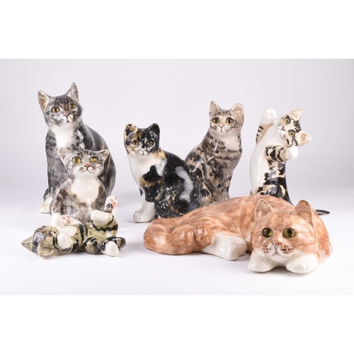 48 - A group of seven Jenny Winstanley pottery figures of orange and grey tabby cats, signed, tallest 30c... 