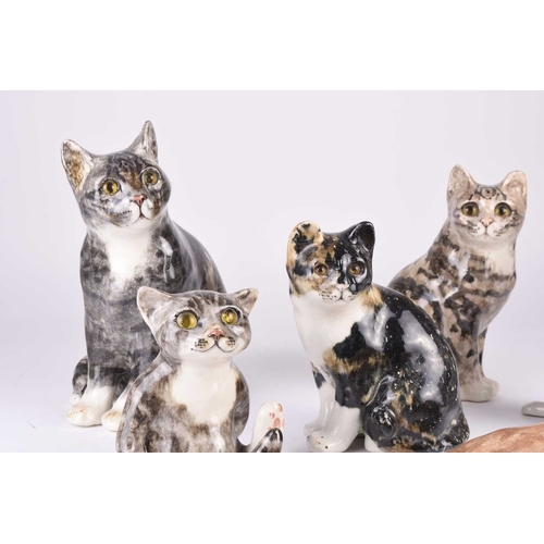 48 - A group of seven Jenny Winstanley pottery figures of orange and grey tabby cats, signed, tallest 30c... 