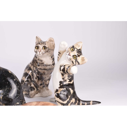 48 - A group of seven Jenny Winstanley pottery figures of orange and grey tabby cats, signed, tallest 30c... 