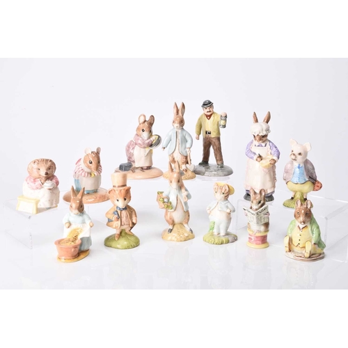 51 - A group of Beswick figures, comprising Mrs Rabbit Baking (English Country Folk); and Beatrix Potter ... 