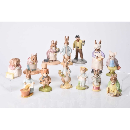 51 - A group of Beswick figures, comprising Mrs Rabbit Baking (English Country Folk); and Beatrix Potter ... 