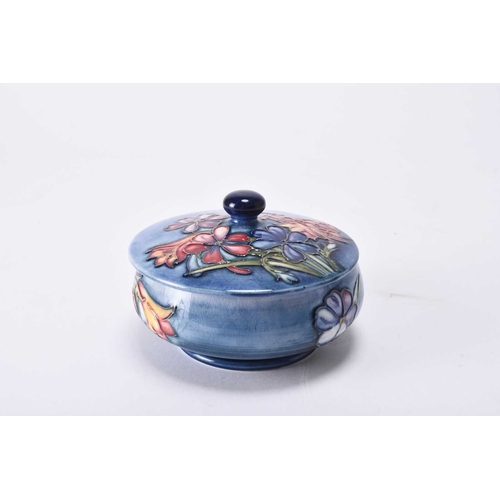 64 - A William Moorcroft 'Spring Flowers' circular powder bowl and cover, circa 1950-60, tubelined with f... 