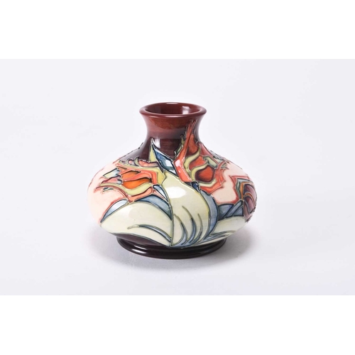 65 - A contemporary Moorcroft 'Red Tulip' vase designed by Sally Tuffin, of squat globular form, dated 19... 