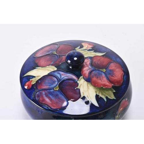 66 - A William Moorcroft large circular powder bowl and cover in the 'Pansy' pattern, circa 1960s/70s, tu... 