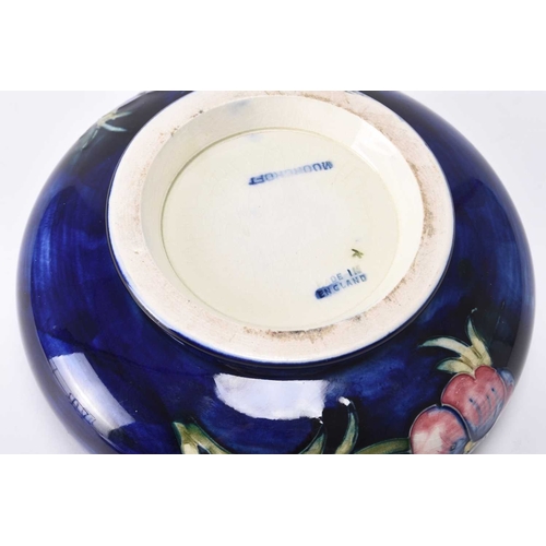 66 - A William Moorcroft large circular powder bowl and cover in the 'Pansy' pattern, circa 1960s/70s, tu... 