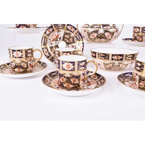 76 - A group of Royal Crown Derby imari coffee wares, pattern 2451, comprising eleven various coffee cups... 