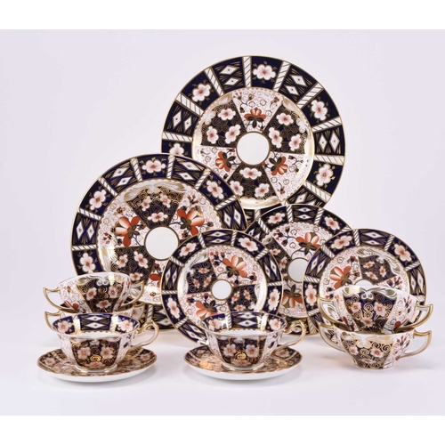 77 - A group of Royal Crown Derby imari dinnerwares, pattern 2451, comprising nine twin-handled soup coup... 