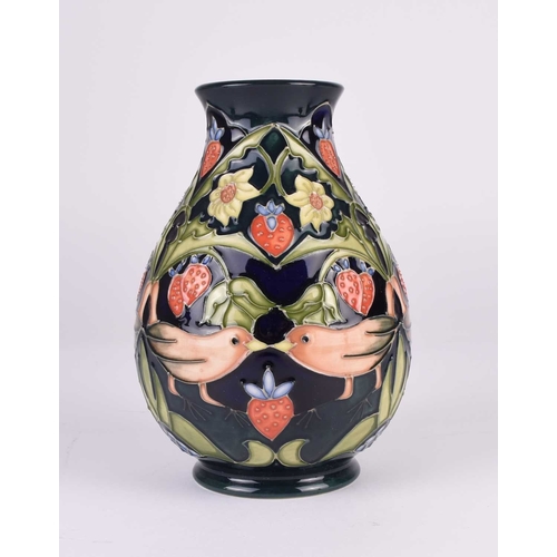 97 - Four pieces of contemporary Moorcroft pottery, 20th/21st century, comprising a 'Blue Finches' vase, ... 