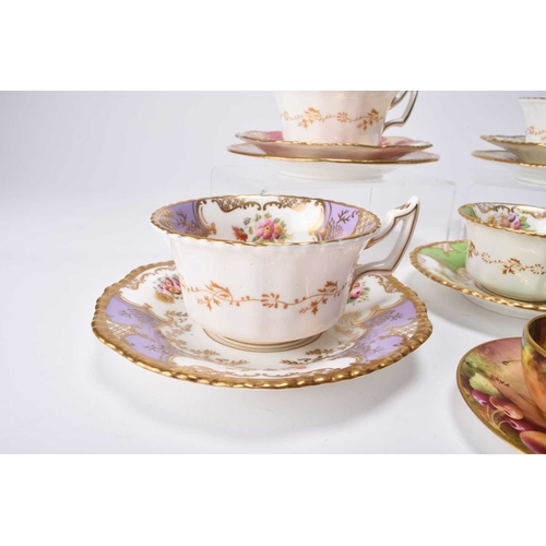 98 - A small group of Coalport batwing teawares, including rarer colourways: a pink trio of teacup, sauce... 