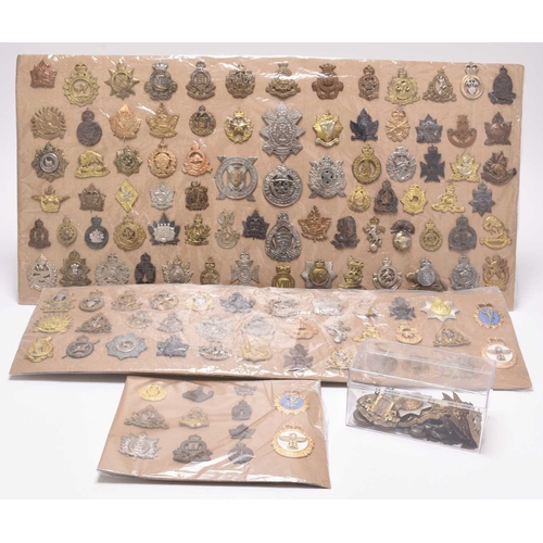 139 - A collection of 150 Canadian military cap badges, some buttons and shoulder titles, mainly WW2 onwar... 