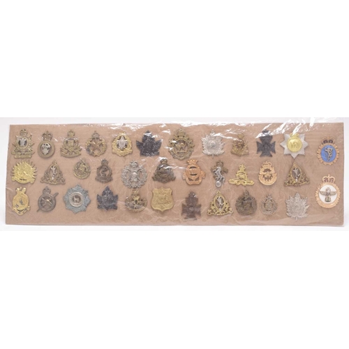 139 - A collection of 150 Canadian military cap badges, some buttons and shoulder titles, mainly WW2 onwar... 