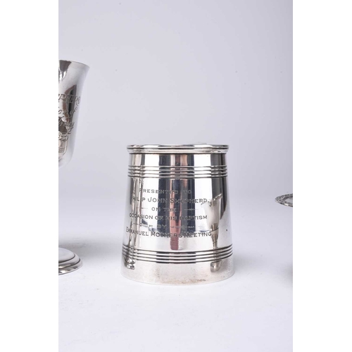 10 - A small collection of silver, comprising; a Christening mug with reeded decoration and presentation ... 