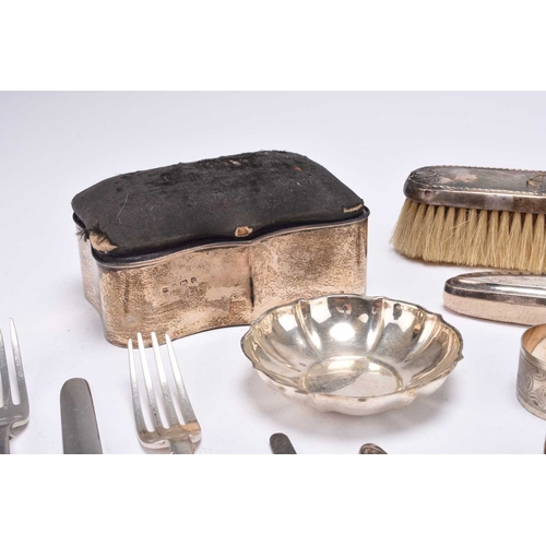 104 - A collection of silver wares, comprising; a silver mounted jewellery box with pin cushion cover, 13c... 