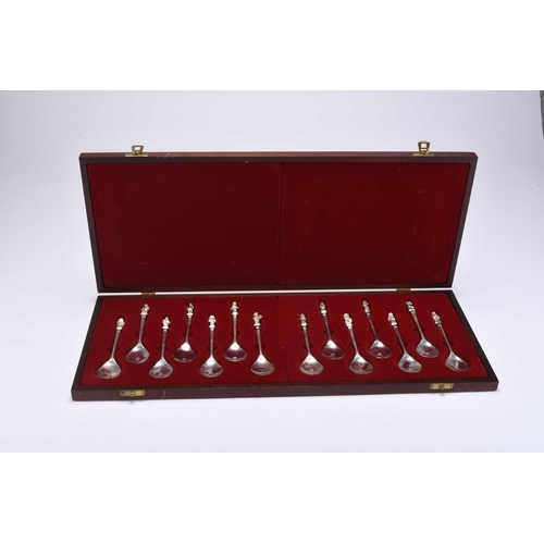 105 - A cased set of figural spoons relating to the 'Monday's Child' rhyme, comprising two sets of six spo... 