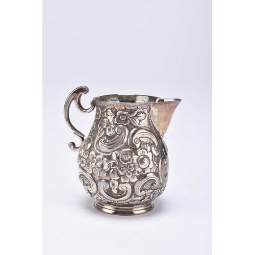 110 - A pair of George III silver salts, James Waters, London 1770, each of cauldron form with embossed fl... 