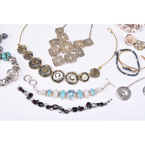 147 - A large collection of various piece of costume jewellery, to include; a white metal bright cut engra... 